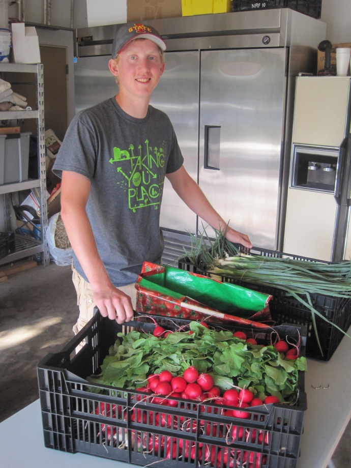 Garrett working delivering a CSA basket to a local restaurant.