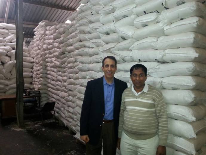 Insta-Pro CEO Kevin Kacere is pictured with a customer in Africa, who extruded 2,000 tons of corn-soy blend for by the World Food Program, which will be used to help feed the world.